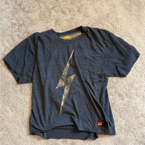 Black aviator nation t shirt with gold lightning bolt